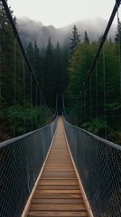 Obraz premium Suspension Bridge in Foggy Forest, Mountain View