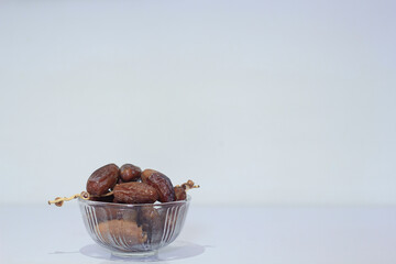 Dates fruit in a glass bowl. Holy month ramadan concept