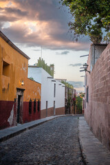 Colorful Colonial Street and Road of San Miguel de Allende Mexico. Mexican streets with colorful houses of all colors in the sunshine
