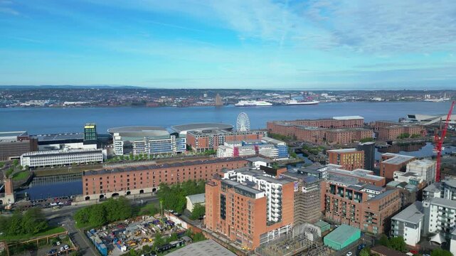 Aerial View of Modern Central Town Center and Downtown Buildings at British City Centre of Liverpool, Maritime city in northwest England, United Kingdom on Beach and Ocean Docks. May 5th, 2024.