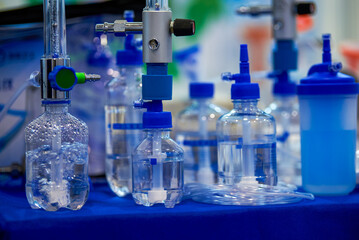 Close-up of a medical infusion flow control bottle