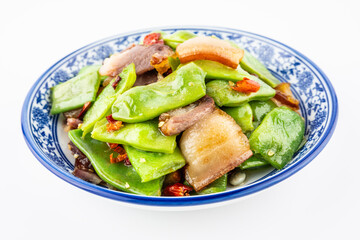 A plate of fried bacon with beans