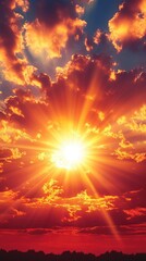 Fototapeta premium Dramatic Orange Sunset with Radiant Sun and Clouds Illuminating the Sky