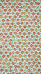 Seamless floral pattern with red and yellow flowers on white background