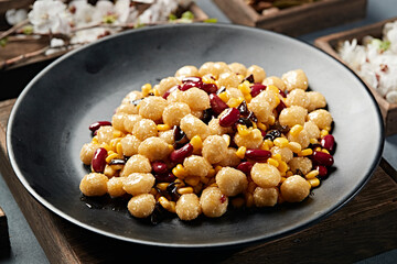 Stir-fried mini sesame balls with black fungus, sweet beans and corn