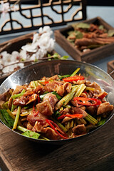 Spicy pork ears with garlic sprouts