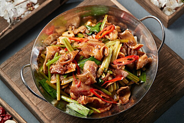 Spicy pork ears with garlic sprouts