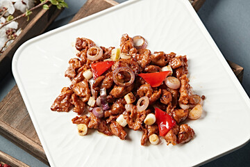 Braised beef tenderloin with scallions and bell peppers