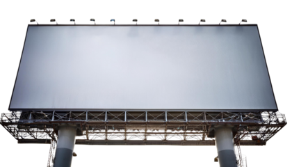 Empty billboard ready for advertisement in urban environment with clear blue sky.