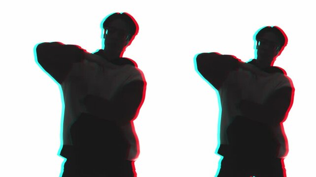 Hip hop dancer. Contemporary choreography. Dark mirrored color contoured double exposure silhouette of cool guy performing freestyle movements isolated on white.