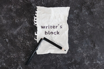 writer's block and overwhelm from deadlines conceptual image with broken pencil and scrunched up...