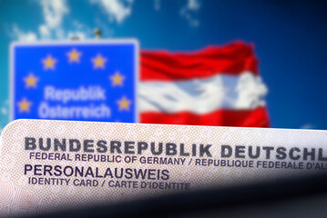 Flagge von Österreich und ein deutscher Personalausweis