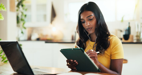 House, student and woman with laptop, tablet and typing with education, internet and prepare for test. Person, apartment and girl with tech, connection and studying for exams and research for project © peopleimages.com