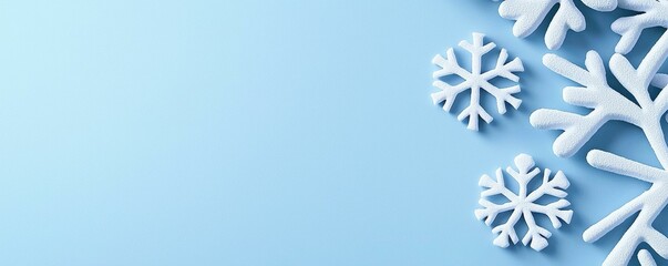 Naklejka premium Winter Snowflakes on Light Blue Background