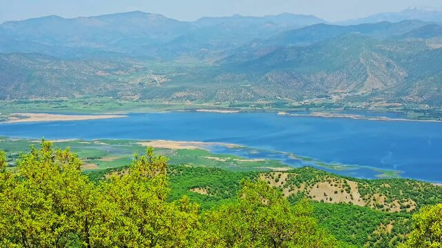 Stunning view of Marivan city with Zagros forests and Lake Zarivar under a clear blue sky.
📍Marivan - Kurdistan