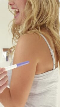 Happy couple discover the pregnancy test