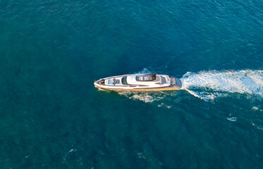 Luxury yacht in sea top view. Boating and yachting tourism. Luxurious lifestyle. Vacations on summer. Yacht at sea. Sea vacation on summer. Travel by sea. Luxury boat motor yacht. Adventure concept