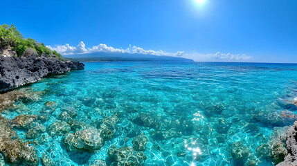 Fototapeta premium Tropical island beach, turquoise water, sunny sky, volcanic rock shoreline, travel destination