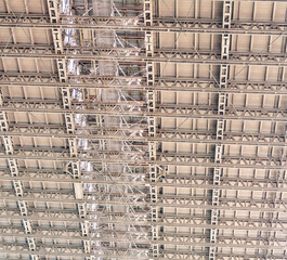 Metal construction background. Structural design engineering. Structure engineering at building site. Framework construction architecture. Architectural detail. Installation of metal structure