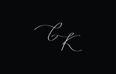 A minimal yet stylish depiction of white cursive lettering forming CK on a dark background, symbolizing elegance and simplicity.