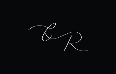 A minimal yet stylish depiction of white cursive lettering forming CR on a dark background, symbolizing elegance and simplicity.