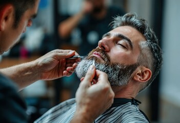 barber trimming beard of senior man
