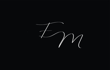 A minimal yet stylish depiction of white cursive lettering forming FM on a dark background, symbolizing elegance and simplicity.