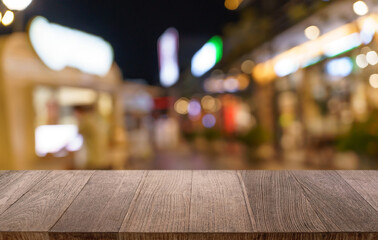 Empty wood table top and blur of restaurant background selective focus product display