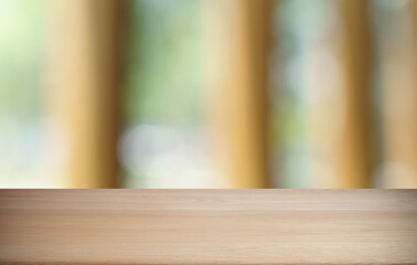 Empty wood table top and blur of restaurant background selective focus product display