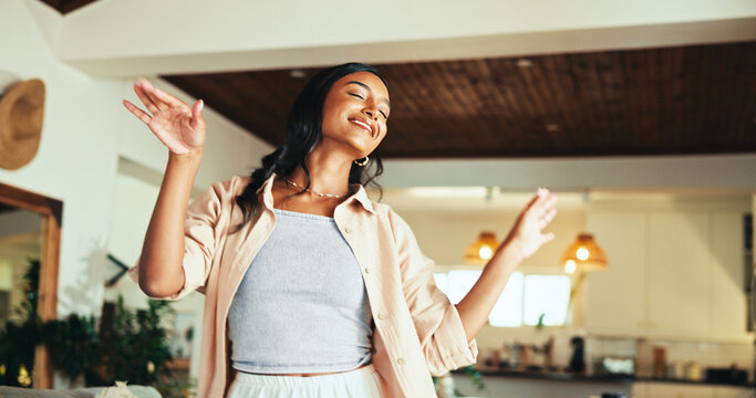 Woman, happy and dancing in home with music, relax and comic in living room with memory in morning. Person, girl and smile with rhythm, excited and talent with joke, crazy and playful at apartment