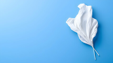 White fabric floats on blue background; design element