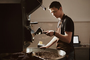 Highly Skilled Barista Operating a Coffee Roaster Machine with Expertise