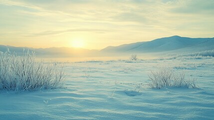 Obraz premium Frosty Winter Sunrise Over Snowy Mountain Range