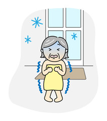 寒い脱衣所で凍えそうなシニア女性