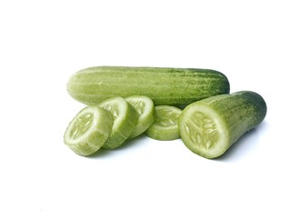 Fresh and slice cucumber isolated on white background. Vegetarian cuisine, Organic farm plant 