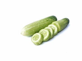 Fresh and slice cucumber isolated on white background. Vegetarian cuisine, Organic farm plant 