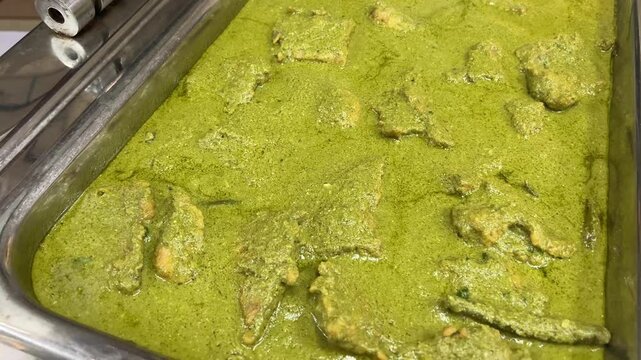 Dhaniya chicken on aluminium tray to be served to guests.