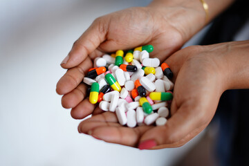 colorful pills in hand. photo
