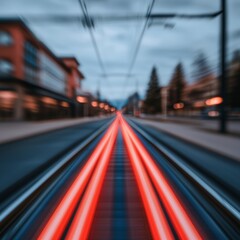 Fototapeta premium Red Light Trails on Urban Train Tracks at Dusk