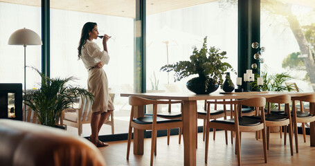 Office, relax and woman with wine, drinking and celebration for promotion with alcohol, thinking or enjoy. Contemplating, glass and career growth for employee in business, sales or person with liquor