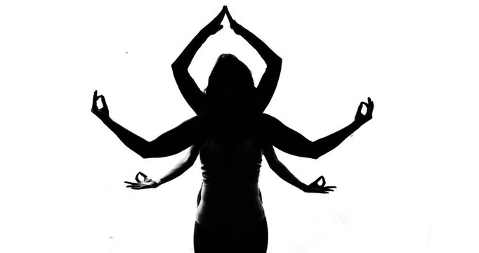 Young women depict the multi-armed goddess Lakshmi in black and white. Religion Hinduism