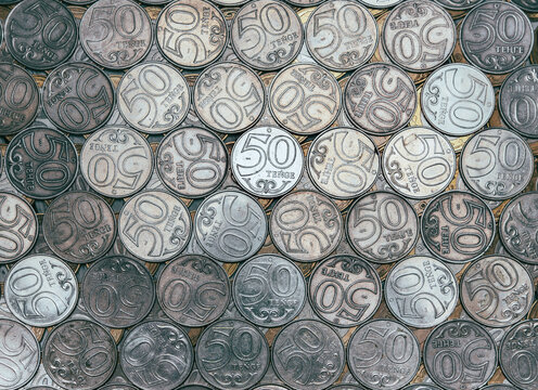 Rows of coins with face value of 50 tenge, top view