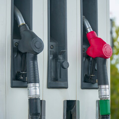 View of the Diesel and petrol fuel pistols at a gas station