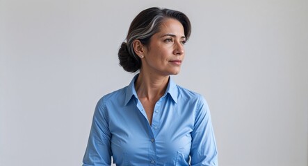 Hispanic woman blue buttonup shirt middle age side view portrait on plain white background