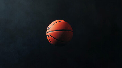 A pristine basketball floating in mid-air against a pure black background.