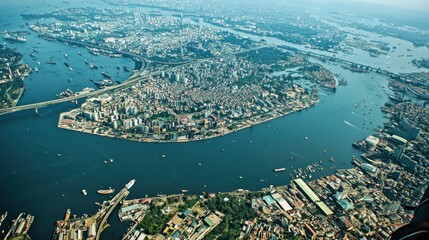 Naklejka premium Aerial view of city harbor with busy port and shipping, dense urban sprawl
