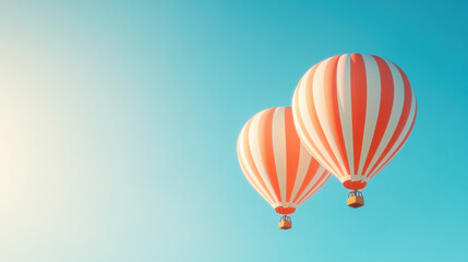 Striped hot air balloons in a clear blue sky