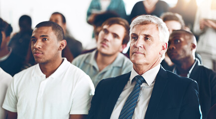 Men, audience and listening at corporate seminar with attention, learning and employee training course. Business people, diversity and crowd at conference, presentation and workshop at finance agency