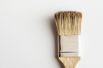 A Minimalist Wooden Brush with Soft Bristles on a Pristine Surface.