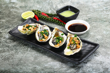 Open half oysters with green onion